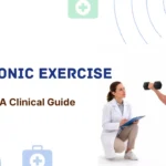 Article header banner for MystPhysio titled Isotonic Exercise A Clinical Guide, showing a female physical therapist with a clipboard monitoring a male athlete performing a dynamic dumbbell lunge.